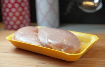 raw-chicken-breast-fillets-in-package-on-wood-boar-2021-08-30-13-44-32-utc